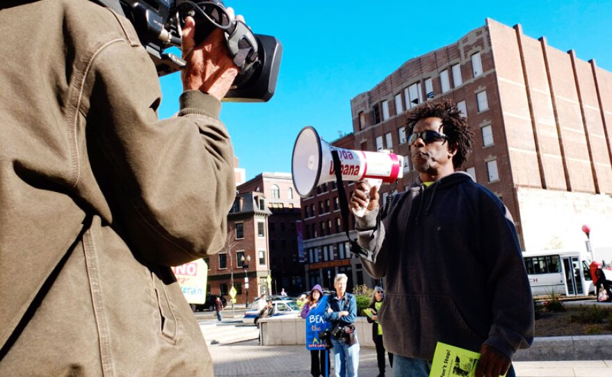 Olivé Hendricks lost his home to foreclosure after the housing bubble burst in 2008, but he has become an activist and joins protesters outside the Housing Court in Boston, Mass.