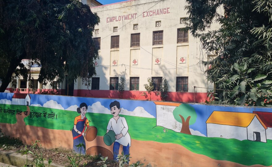 The Employment Exchange building in the city of Prayagraj, home to government offices that address job-related issues. The mural in front of the building urges people to throw trash in garbage cans.
