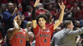 San Diego State guard Adam Seiko (2) and guard Trey Pulliam (4) celebrate during the second half of an NCAA college basketball game against Nevada, Saturday, Jan. 18, 2020, in San Diego.