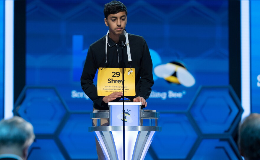 Competitors had to hit a flashing buzzer in order to hear the next word during the spell-off rounds.