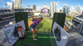 A woman tees off from the third hole, located on the upper deck of Petco Park during the week of Nov. 2, 2015.