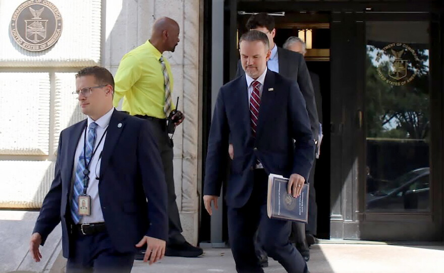 United States Trade Representative Jamieson Greer, center, leaves the U.S. Department of Commerce following a meeting with Canadian officials, in Washington, Monday, Aug. 17, 2026.