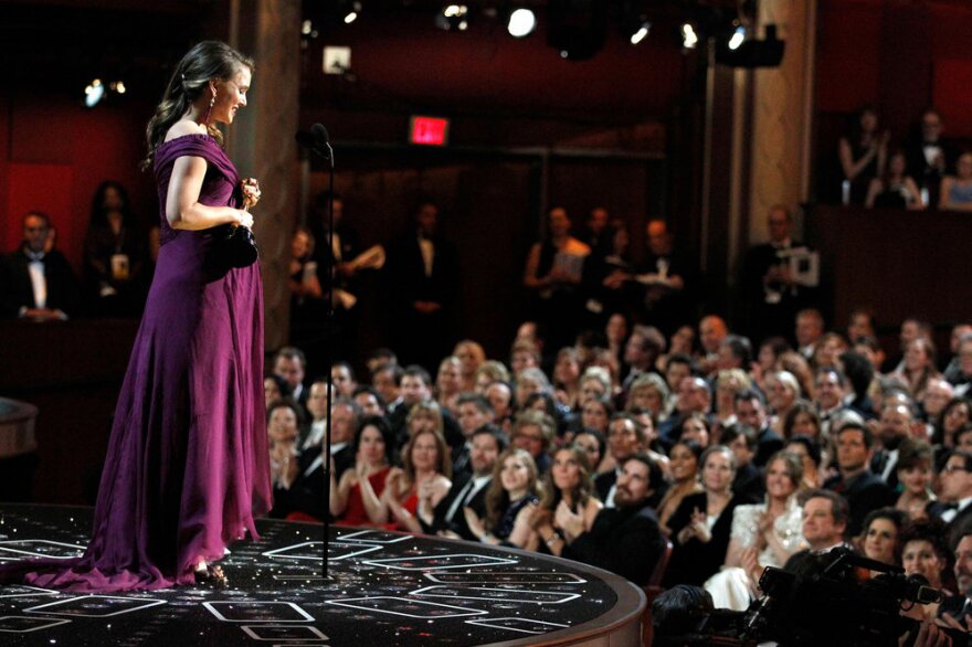 Natalie Portman accepts the Oscar for Best Actress for her performance in <i>Black Swan.</i>