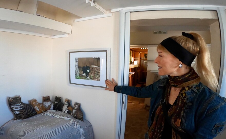 The founder and head of Shanti's House, Kristina Hancock, shows a KPBS crew around the sanctuary's main cottage on April 6, 2022.