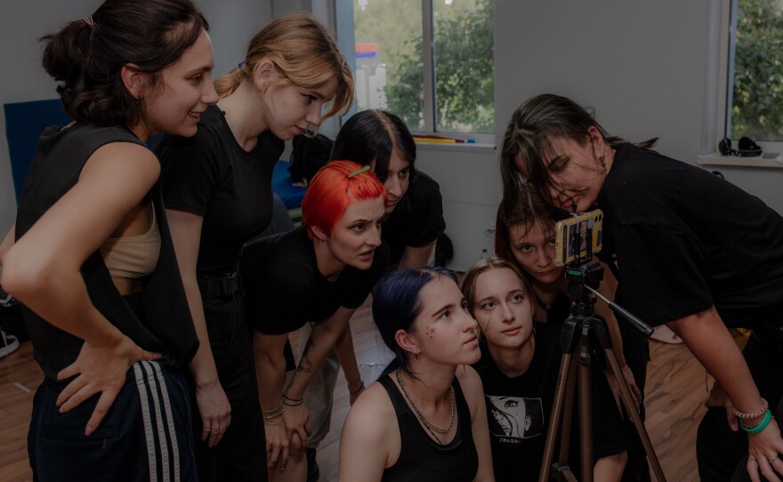 After each take, Phantom Blue dancers check the recording for mistakes to correct and ways to improve.