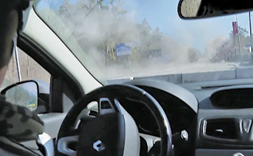 A view from inside the Fox News reporting team's car after a missile hit in front of it.