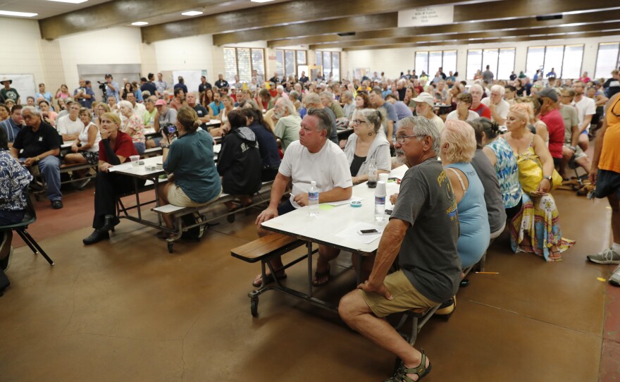 Residents from the lava-affected areas attend a community meeting at Pahoa High School in Pahoa on Friday.