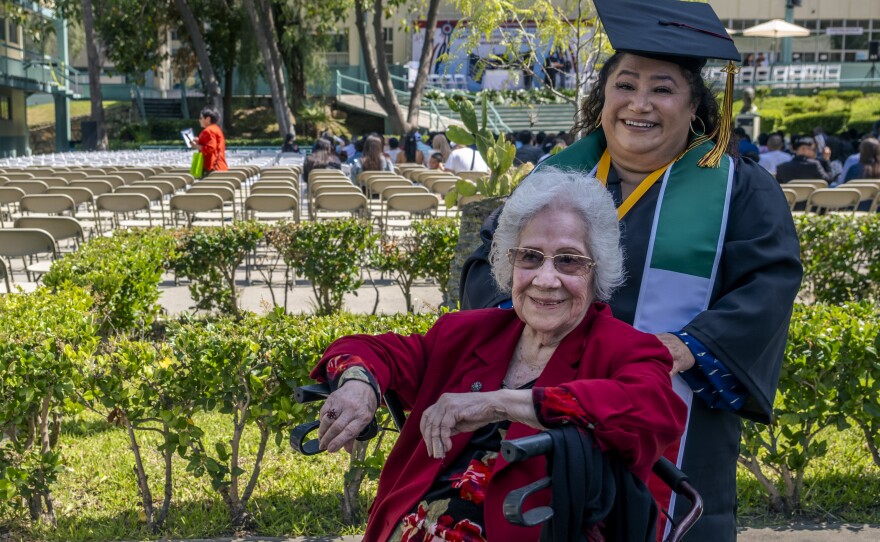 Christine Baeza Castillo celebrates graduation with her grandmother, Cristina Castillo, 93, who lives in Tijuana and has not been able to cross the border, Tijuana, Mexico, June 15, 2023.