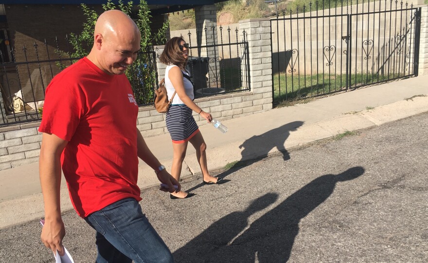 Republican field organizer Sergio Arellano and a volunteer canvass in Nogales, Ariz.