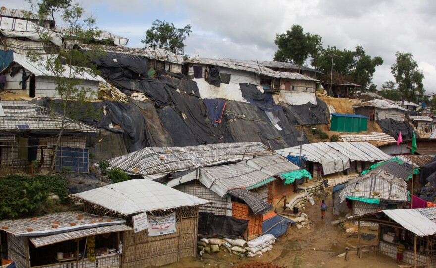 Tarps have been draped over steep sand cliffs in the Balukhali Rohingya refugee camp in Bangladesh to keep them from collapsing.
