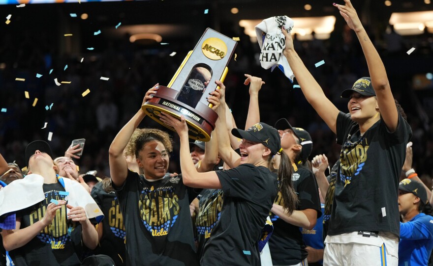 UCLA players celebrate after defeating South Carolina in the women's National Championship Final Four NCAA college basketball tournament game on Sunday in Phoenix.