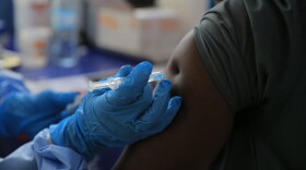 A health care worker administers a dose of Ervebo vaccine against the Ebola virus in Beni, North Kivu province, eastern Congo, on Oct. 16.