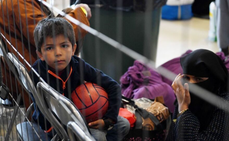 Afghan refugees wait to be processed Sept. 8 inside Hangar 5 at Ramstein Air Base in Germany.