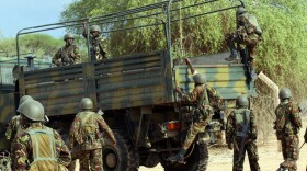 Kenyan soldiers climb into a truck as they prepare to advance near Liboi in Somalia on Oct. 18. Kenya now has a few thousand troops in the lawless country, trying to pursue a militant Islamist group called al-Shabab. 