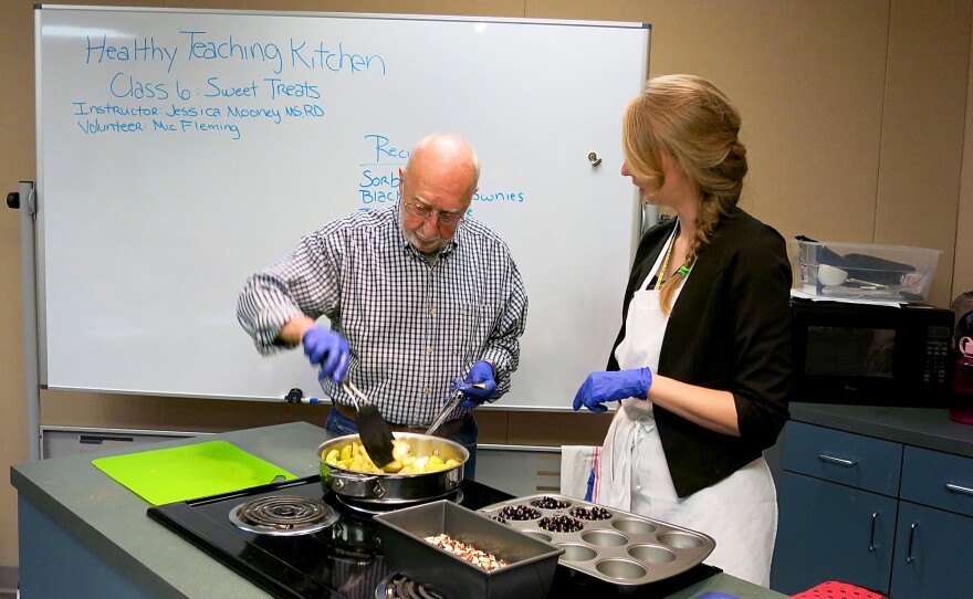Ray Spaulding cooks apples in front of a class on cooking healthful desserts at the Portland VA withJessica Mooney, right, a clinical dietitian. About 80 percent of veterans are overweight and obese and another quarter have diabetes, according to the Department of Veterans Affairs.