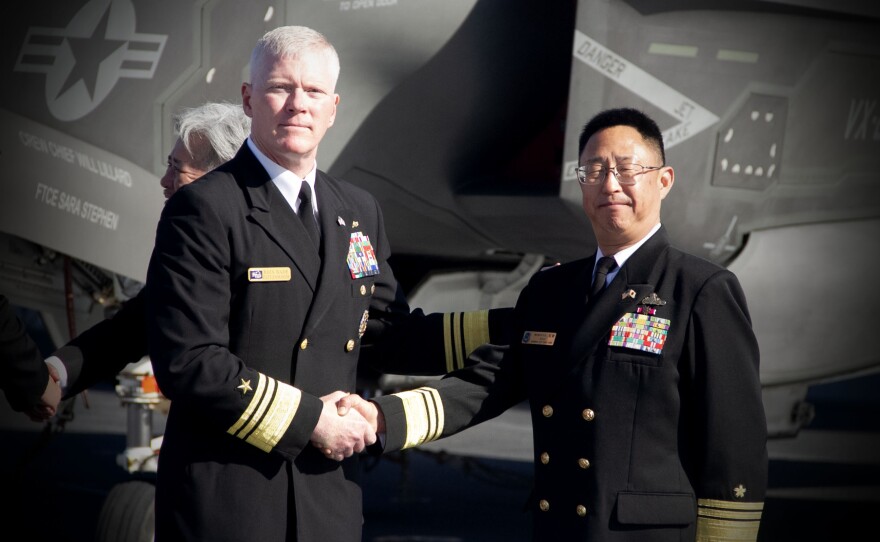Vice Adm. John Wade, the commander of U.S. 3rd Fleet and Vice Adm. Goka Yoshihiro, commander of Japan's Fleet Escort Force, shake hands. Nov. 6, 2024.