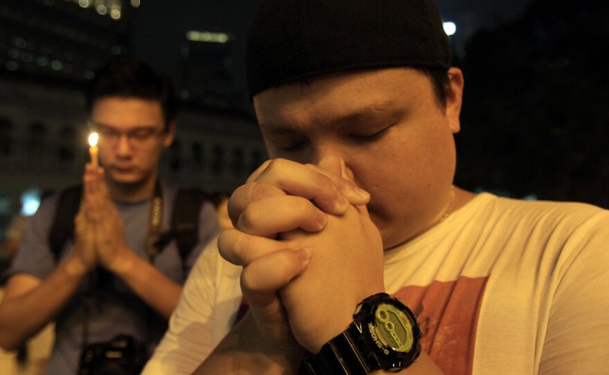 In Kuala Lumpur, people continue to offer prayers for the 239 people missing after the disappearance of Malaysia Airlines Flight 370.