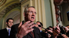 Senate Majority Leader Harry Reid speaks with reporters Tuesday after the Senate cleared a hurdle to restore unemployment benefits to millions of Americans who have been out of work for more than six months.