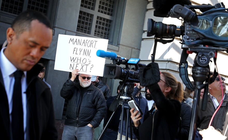 Protesters outside the federal courthouse where Michael Flynn pleaded guilty early this month speculate what is coming next in the special counsel probe.
