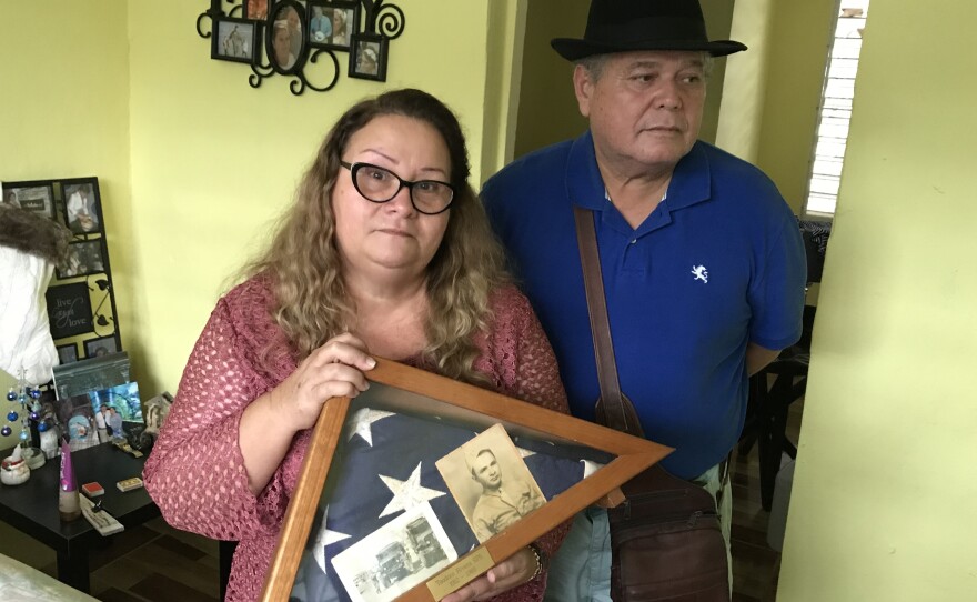 Irma Rivera Aviles and her husband Ivan Martínez live in a tight-knit working-class community called El Pueblito in Cataño. Their community flooded during Hurricane Maria leaving their house damaged with a hole in the roof.