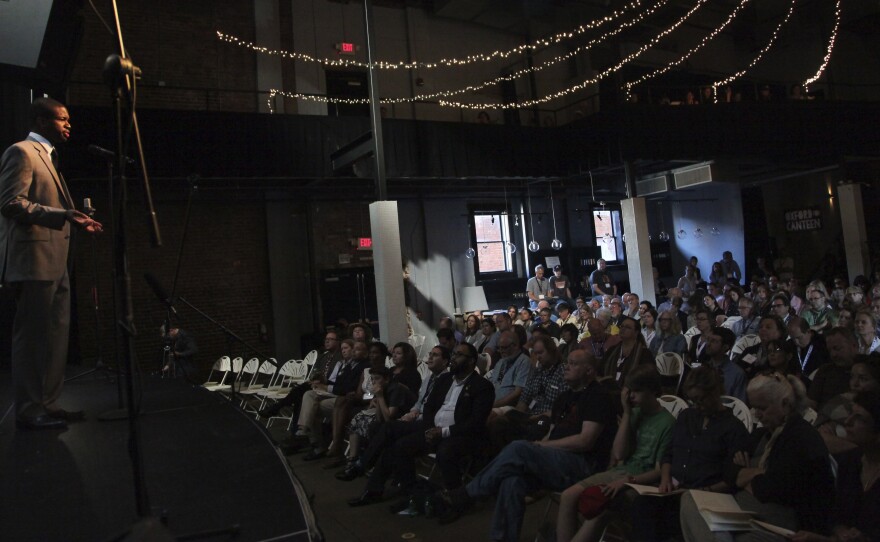 Bass-baritone Justin Hopkins sings during a tribute show commemorating Booker Wright.