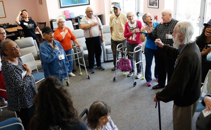 Clients at the Florence Gray Soltys Adult Day Health Program in Hillsborough, N.C. sing the national anthem along with dementia expert Teepa Snow in spring of this year. Singing can help relieve dementia symptoms and maintain brain function, and can help individuals communicate when they no longer have words.