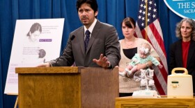 Democratic State Senator Kevin de León speaks form a podium. 