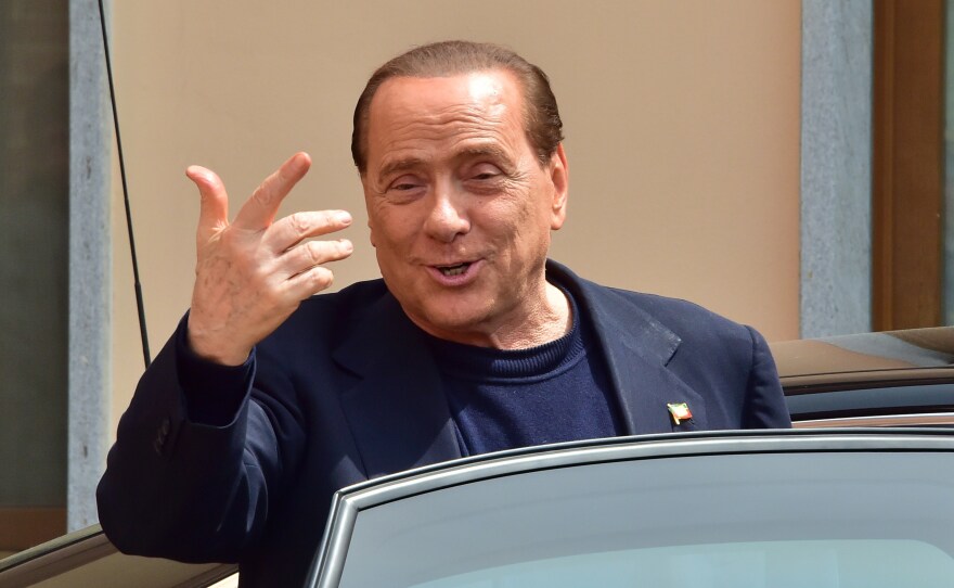 Former Italian Prime Minister Silvio Berlusconi leaves a Catholic hospice in Cesano Boscone on May 9, 2014, after serving his first day of community service for tax fraud.