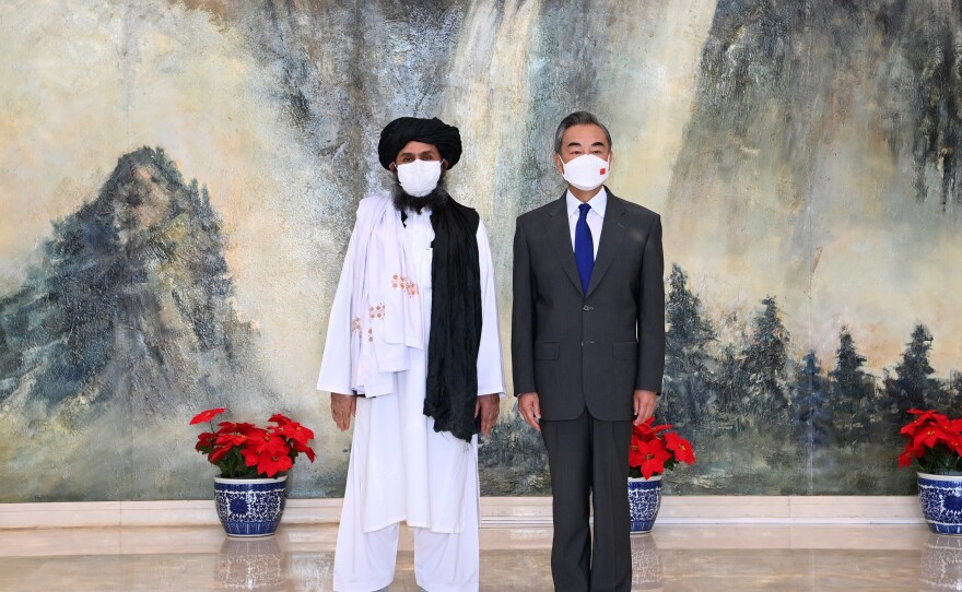 Chinese Foreign Minister Wang Yi meets with Afghan Taliban leader Abdul Ghani Baradar in Tianjin, China, on July 28, 2021.