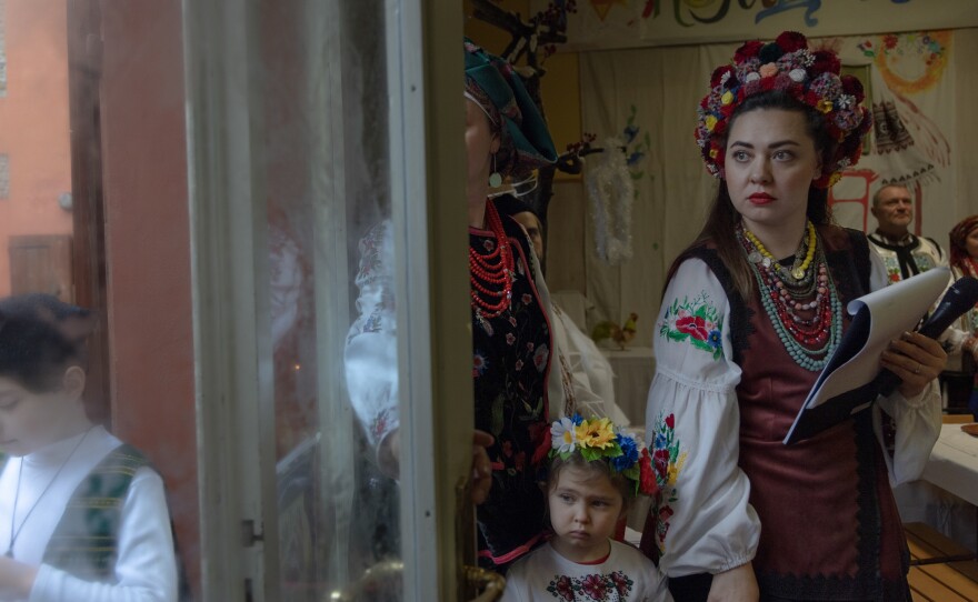 Ukrainian caregivers and their family gather to celebrate Ukrainian Christmas, although not on the precise day of the holiday, in Bologna, Italy, in January 2023. Continuing to celebrate holidays despite the grief of the war allows Ukrainians in Italy feel closer to their homeland.