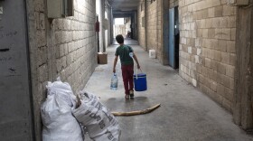 A child fetches water at a textile factory in Gaziantep, Turkey. Many children who work at this factory are migrants who escaped Syria with their families. They typically work 8 to 12 hour shifts, 6 or 7 days a week for just $15 a day. In 2021, 28 million people were estimated to be working under forced labor conditions — an eighth of them children.