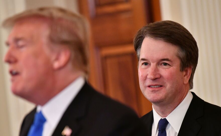 Supreme Court nominee Brett Kavanaugh listens to President Trump announcing his nomination in the East Room of the White House on Monday.
