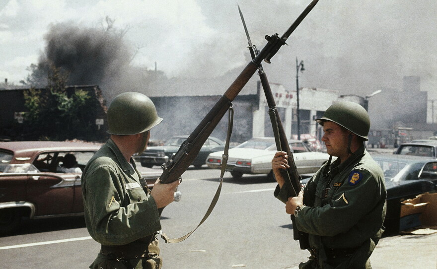 National Guard members patrol the streets after riots in Detroit, Mich. in July 1967.