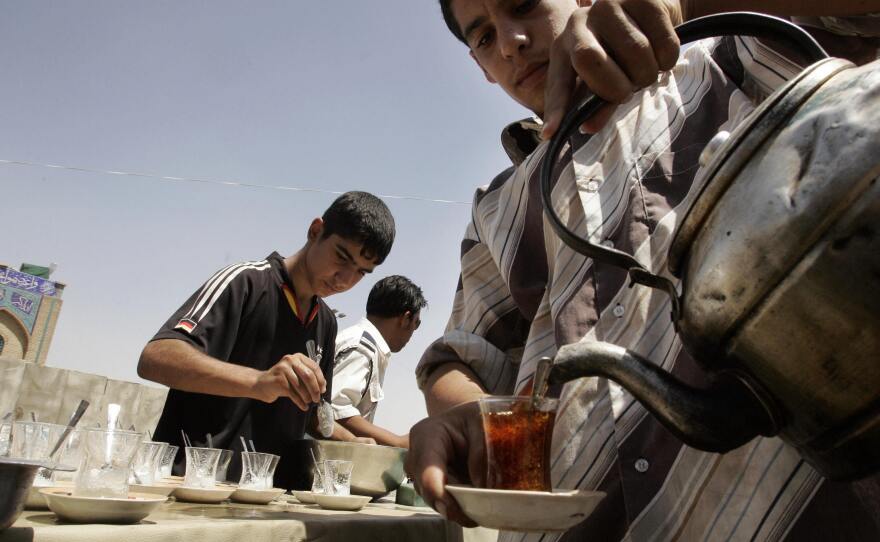 In Iraq, tea is simmered for about 15 minutes until strong and is then poured into glasses . diluted with hot water and sweetened with lots of sugar.