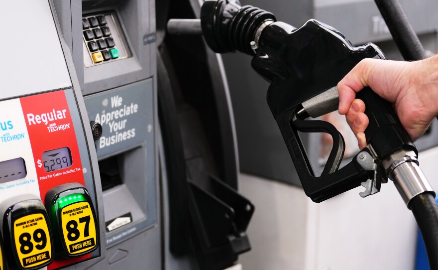 A customer fuels up with regular gasoline priced at $5.29 at a Chevron gas station in Bellevue, Wash., Friday, March 13, 2026.