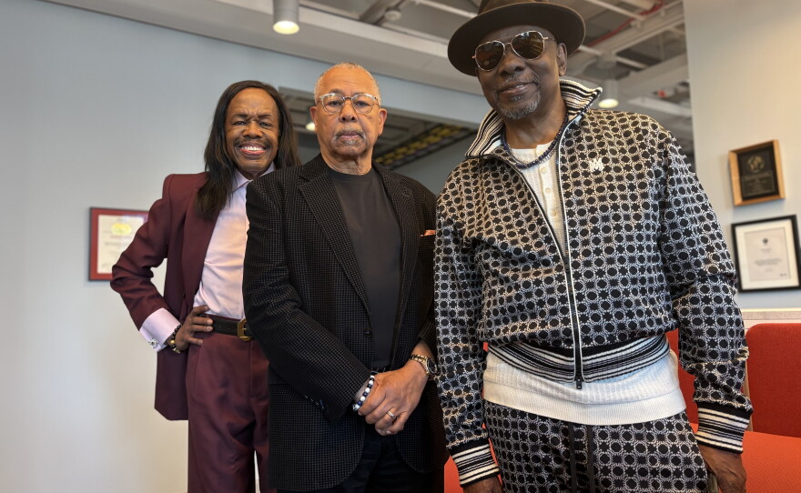 Earth, Wind & Fire members Verdine White, left, Ralph Johnson, center, and Philip Bailey pose for a portrait at NPR's New York bureau on June 2. The band members spoke with Morning Edition about the new HBO documentary Earth, Wind & Fire (To Be Celestial vs That's the Weight of the World)