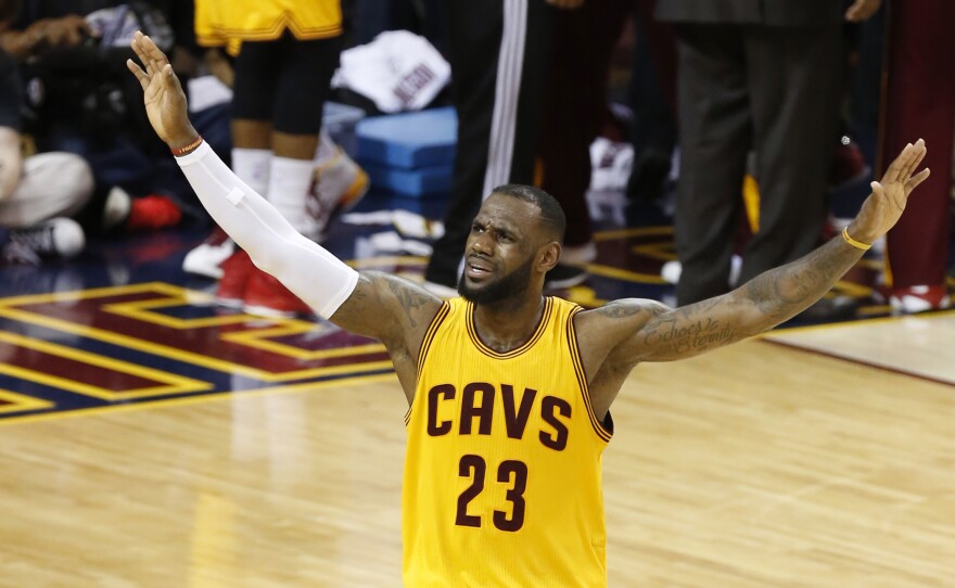 Cavaliers forward LeBron James urges on the crowd during the second half of Game 3 of the NBA Finals against the Golden State Warriors in Cleveland. The Cavs lead the series 2-1 and host Game 4 Thursday night.