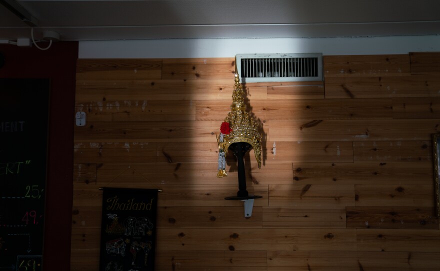 Thai decorations adorn the walls of the restaurant.