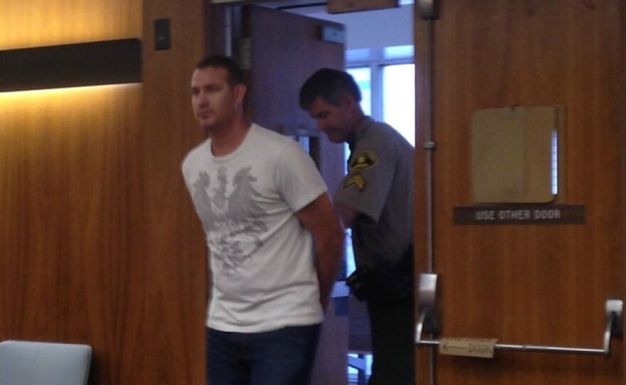 Christopher Hays, a former San Diego police officer, surrenders at the downtown courthouse to begin serving a one-year jail sentence, Oct. 3, 2014.