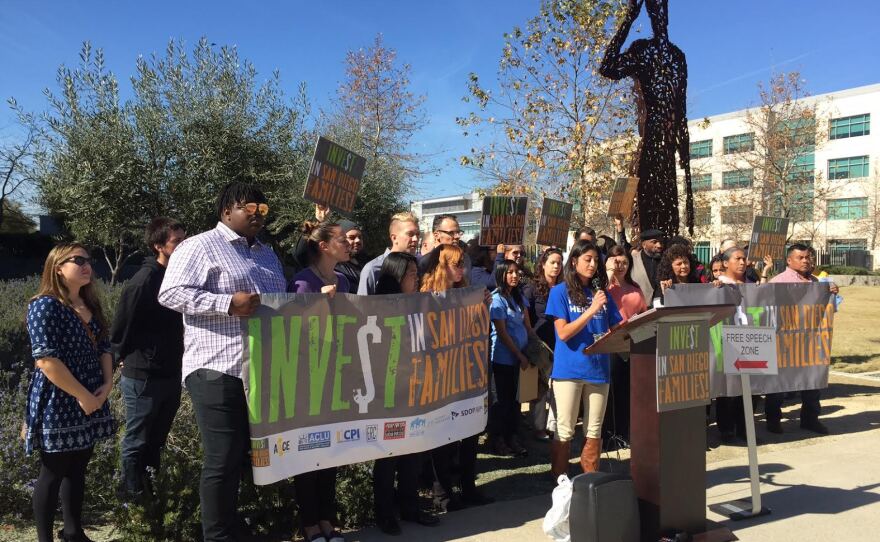 Demonstrators part of the Invest in San Diego Families coalition protest outside of the County Administration Building, Feb. 1, 2017.