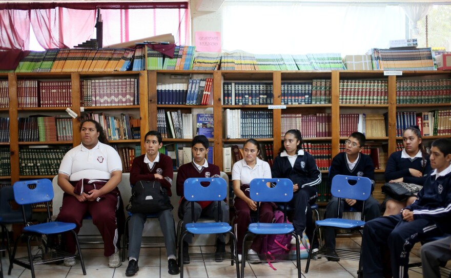 Recent arrivals sit in class at the Eucario Zavala Secondario 63 school in Tijuana, Mexico.