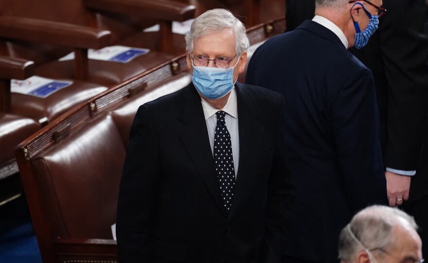 Senate Majority Leader Mitch McConnell arrives Wednesday for the Electoral College vote certification for President-elect Joe Biden, during a joint session of Congress.