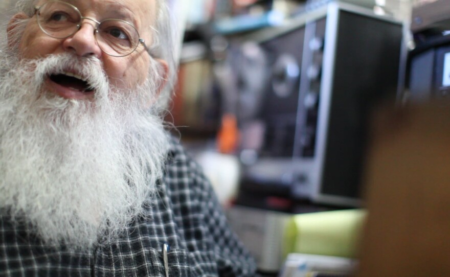 Lou Curtiss plays music for Gregory Page in his store, Oct. 21, 2013.