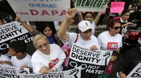 Demonstrators, led by the New Orleans Worker Center for Racial Justice and the Congress of Day Laborers, participate in a rally outside the U.S. Fifth Circuit Court of Appeals in New Orleans, April 17, 2015. 