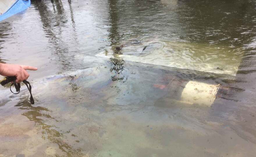 The Hero is causing an oily sheen on the water, and will likely continue to do so until the vessel is removed.