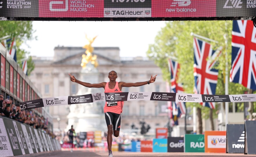 Sebastian Sawe from Kenya crosses the finish line to win the men's race at the London Marathon in London, Sunday, April 26, 2026.