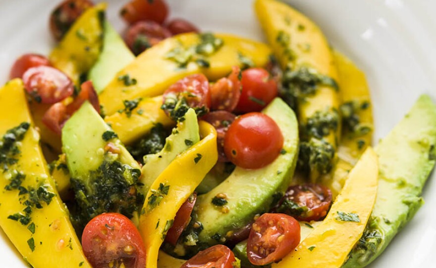In this episode, host Chris Kimball continues his adventure exploring Senegalese cuisine. Chris and Milk Street cook Matthew Card create a Senegalese avocado and mango salad with rof, a topping that consists of parsley, garlic, scallions and habanero chili.