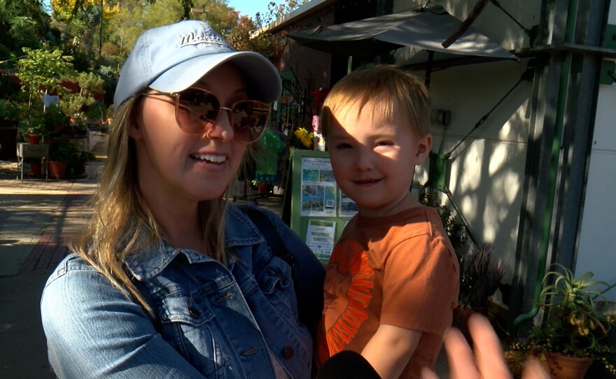 Garden member Ashley Albert is shown holding her 5-year old son Jayden at the garden on November 19, 2024.
