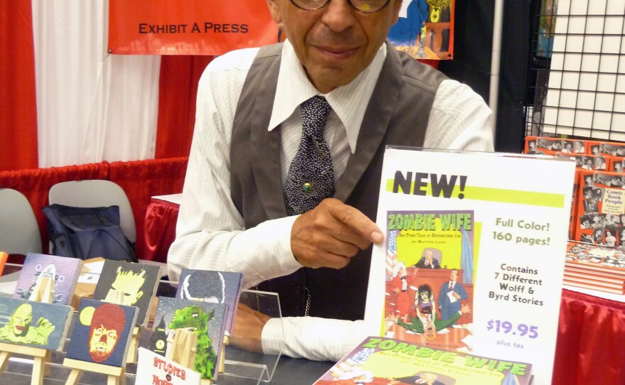 The late Batton Lash at his booth at Comic-Con.