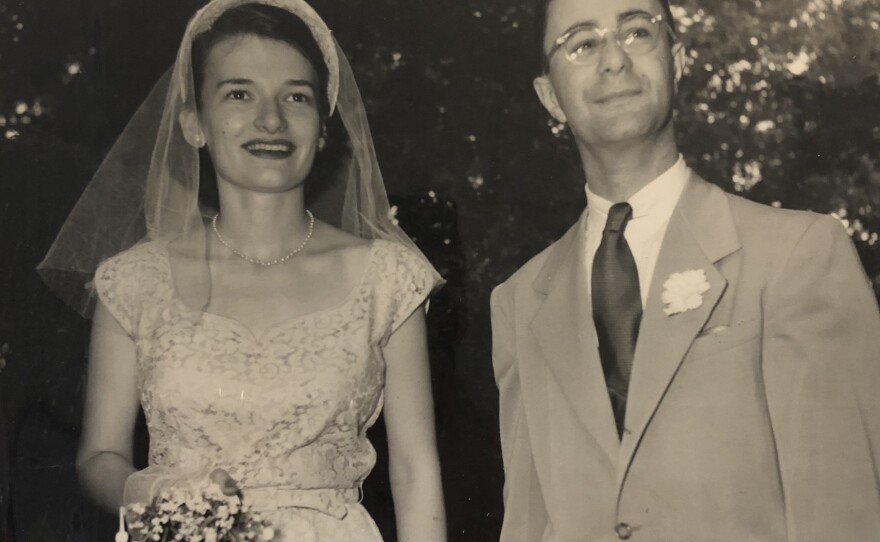 Elisabeth Simons stands with her husband, Harold Simons, at their wedding.